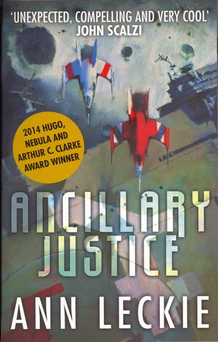 Cover of the Orbit UK paperback edition of Ann Leckie's Ancillary Justice, showing two fighter craft crossing paths above a warship silhouette, with a Hugo, Nebula, and Arthur C. Clarke Award banner
